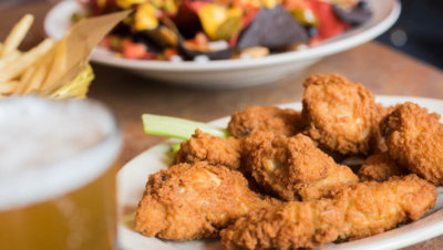 Chicken wings, nachos, fries, and beer