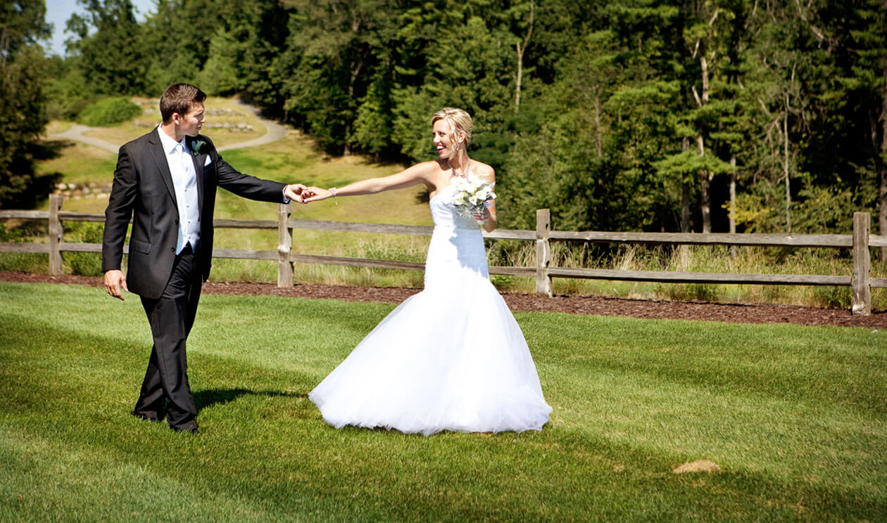 Couple taking wedding photos on a golf course