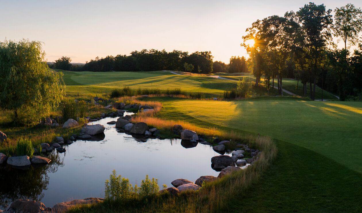 Golf course water hazard at dawn