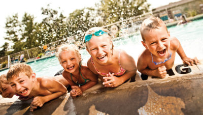 children on edge of pool