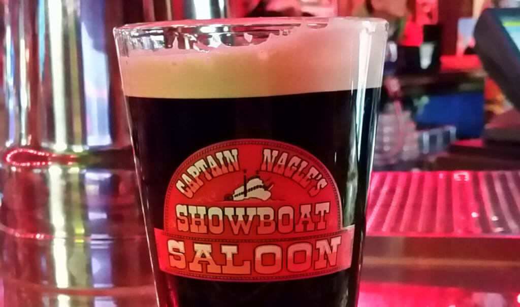Showboat Saloon Beer Glass Filled with Dark Beer