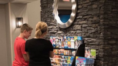 Mother and son at brochure rack